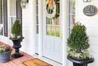 Charming Farmhouse Front Entry with Stylish Planters