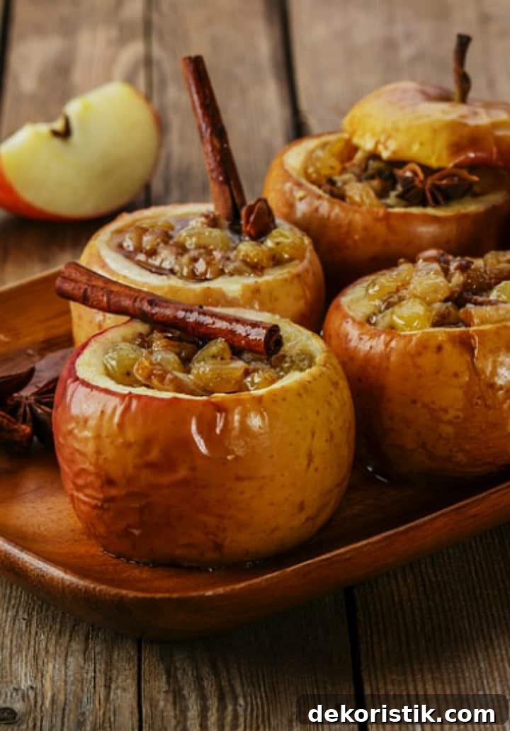 Baked Apple Recipe with Cinnamon and Brown Sugar 2 Delicious recipe for baked honeycrisp apples with the baked apples on a wooden platter.