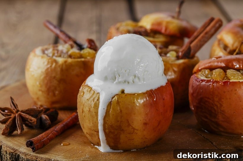 Baked Apple Recipe with Cinnamon and Brown Sugar 6 A baked apple with a dollop of ice cream on top.
