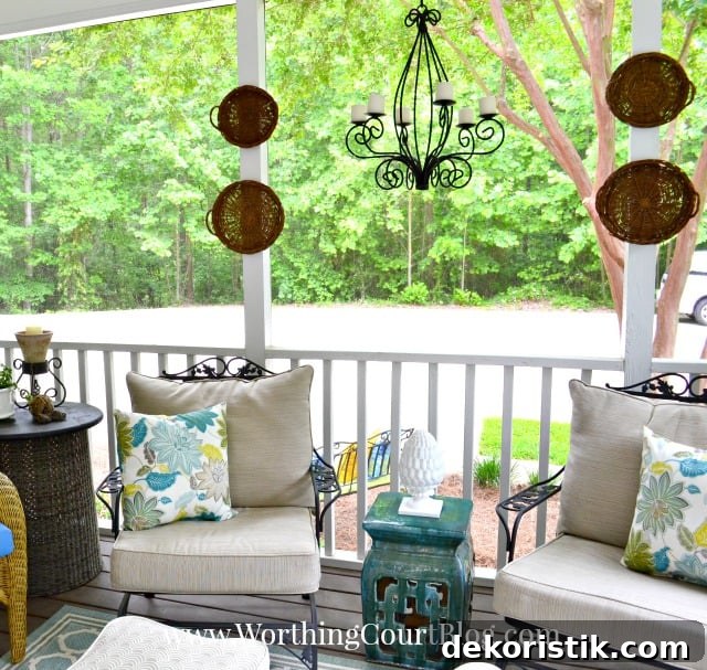 A wrought iron light fixture hangs on the porch.