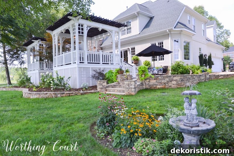 The house after the new deck with two pergolas painted white.