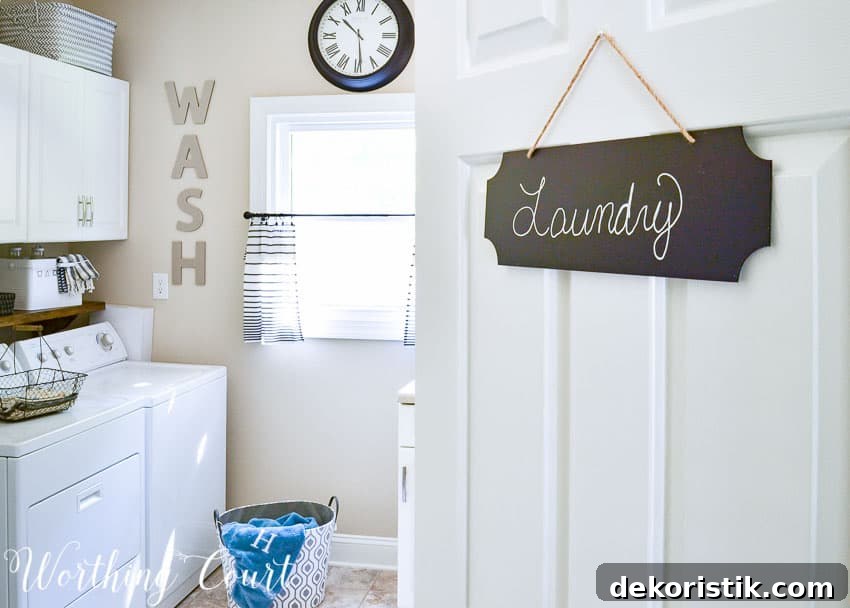 Transform a Cluttered Laundry Room into a Bright, Organized Space 2 Chalkboard sign for the laundry room door.
