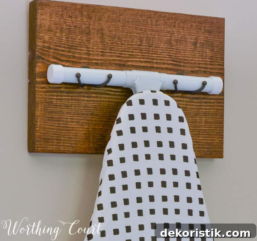 Transform a Cluttered Laundry Room into a Bright, Organized Space 14 DIY wooden ironing board hanger || Worthing Court