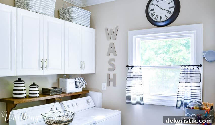 laundry room with white cabinets