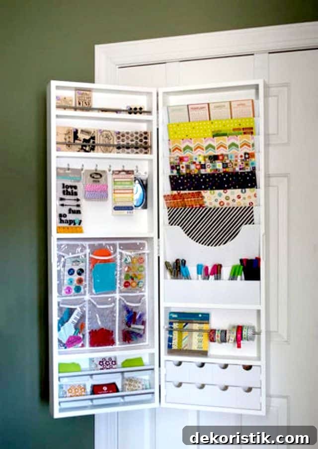 Over-the-door hanging armoire storing craft supplies