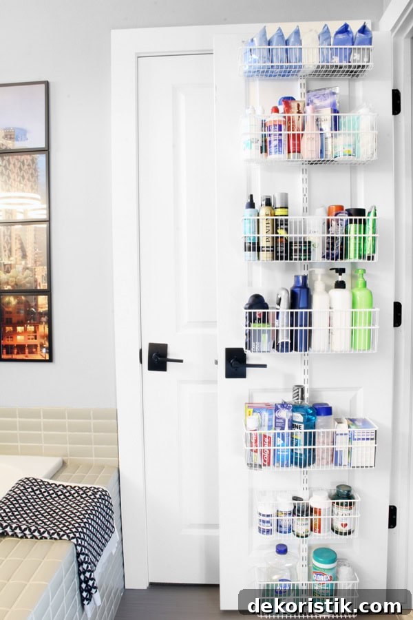 Wire baskets on the back of a bathroom door holding toiletries