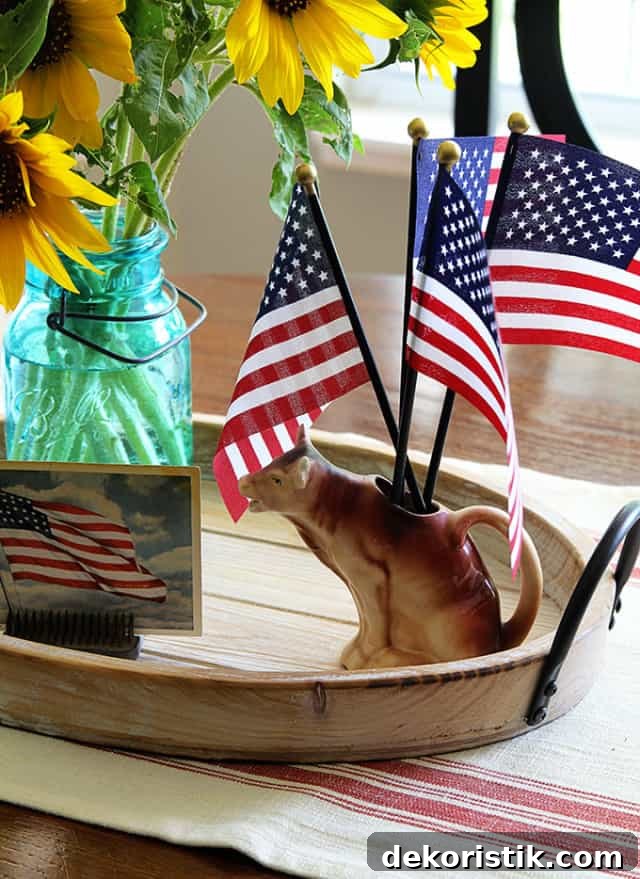 Patriotic Red, White and Blue Decorating Ideas 6 round wood tray with American flags in a pitcher