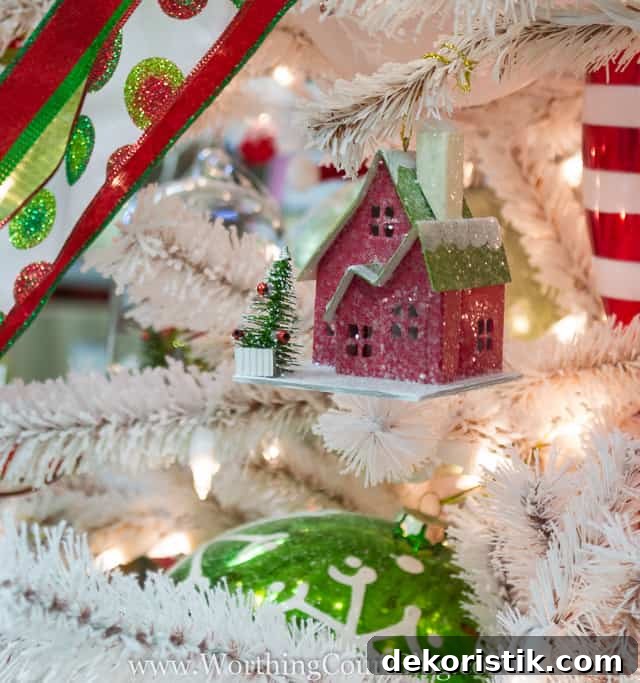 An adorable little house tucked into a Christmas tree