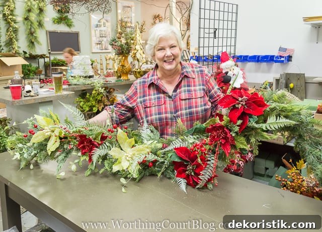 A woman holding the pretty garland.
