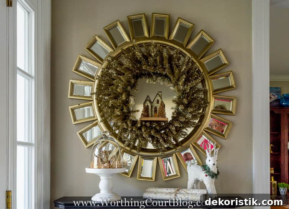 There is a small village in a wreath inside of the mirror.