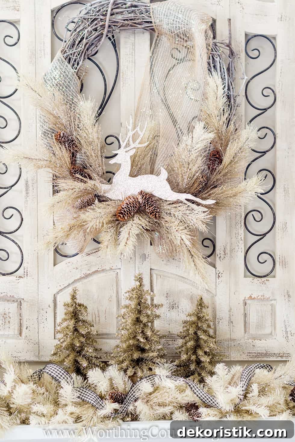 Finally: Christmas Tree and Mantel Decor Reveal 9 A white deer is on a holiday wreath.