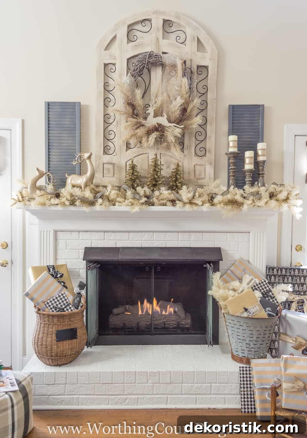 Finally: Christmas Tree and Mantel Decor Reveal 10 A white fireplace with baskets flanking the sides of it and a mantel decorated for Christmas.