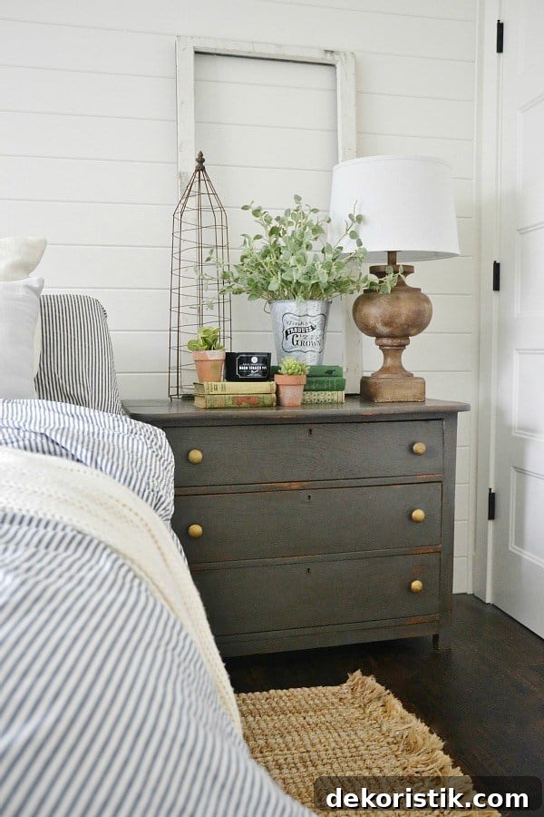 A small chest used as both a nightstand and clothing storage.