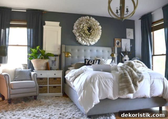 A blue/grey room with a small area rug.