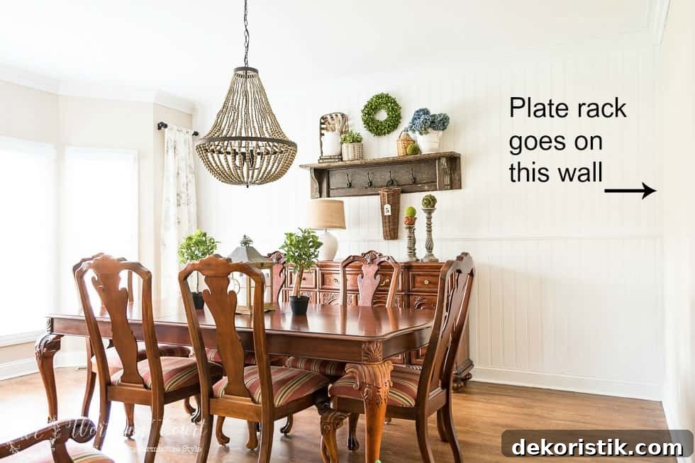 The dining room with an arrow pointing to where the plate rack will go on the wall.