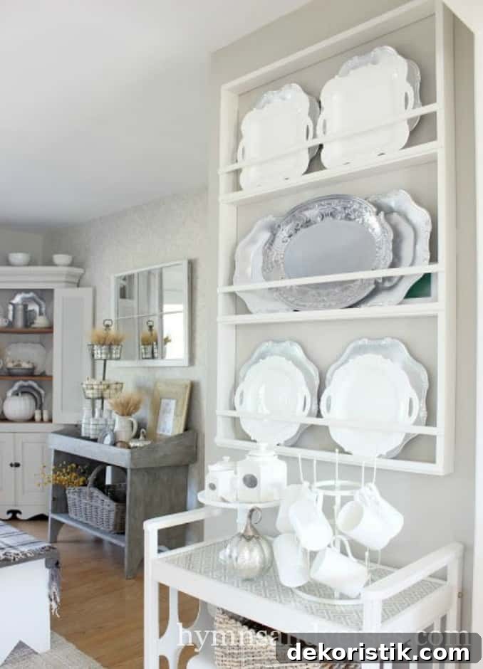 A large plate rack filled with china and stainless steel plates.