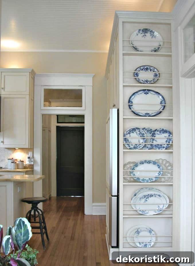 A tall narrow plate rack on the side of a wall.