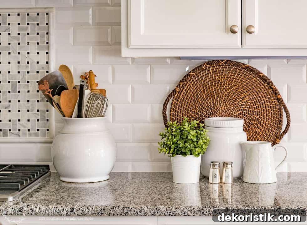 There is a woven serving tray against the white backsplash in the kitchen.