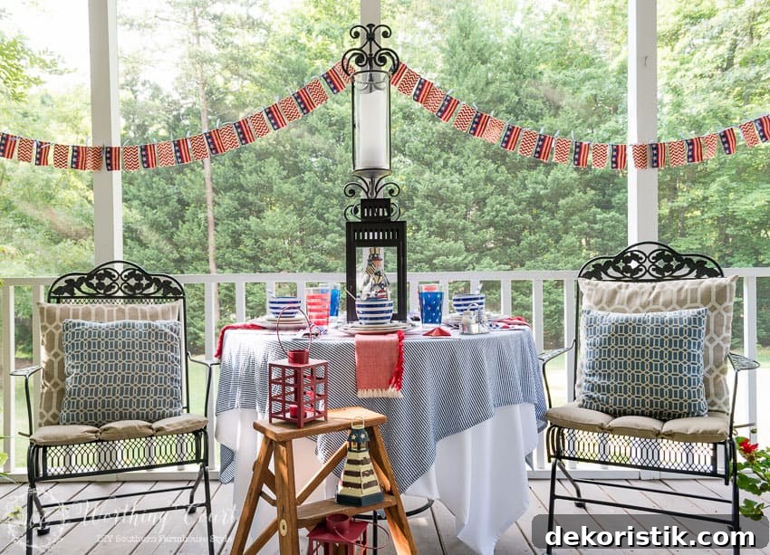 A patriotic table setting on a farmhouse porch filled with loads of red, white and blue vintage Americana patriotic decorating ideas for Memorial Day, Flag Day and July 4th.