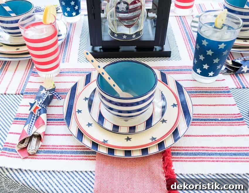 A patriotic table setting on a farmhouse porch filled with loads of red, white and blue vintage Americana patriotic decorating ideas for Memorial Day, Flag Day and July 4th.