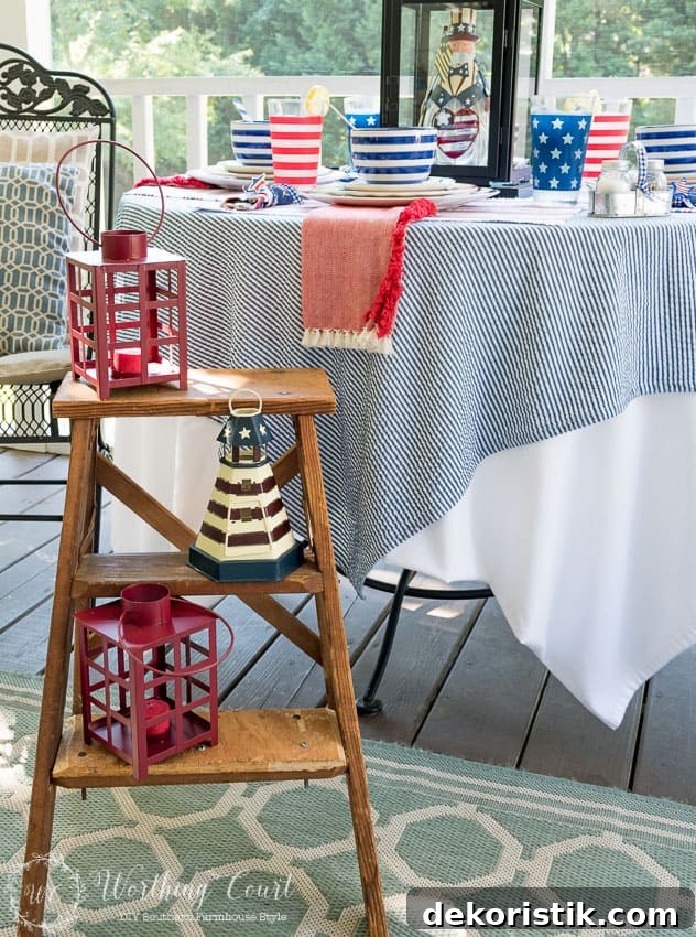 A farmhouse porch filled with loads of red, white and blue vintage Americana patriotic decorating ideas for Memorial Day, Flag Day and July 4th.