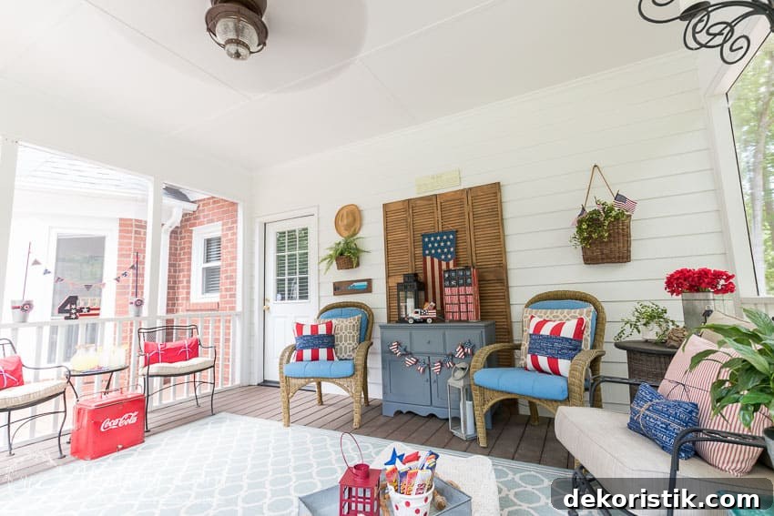 A farmhouse porch filled with loads of red, white and blue vintage Americana patriotic decorating ideas for Memorial Day, Flag Day and July 4th.