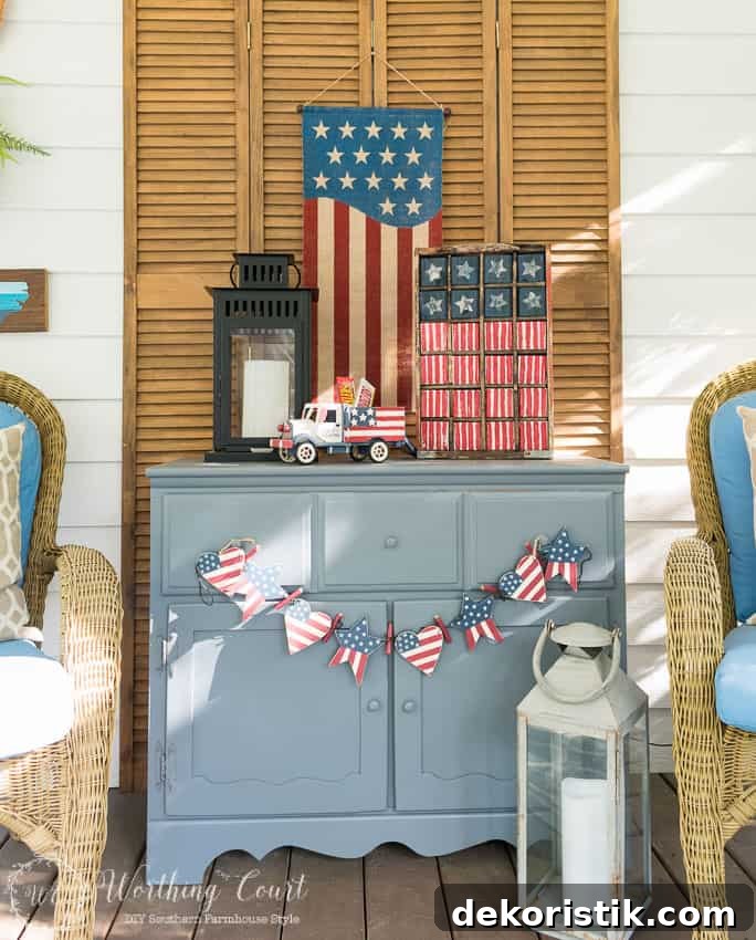 A farmhouse porch filled with loads of red, white and blue vintage Americana patriotic decorating ideas for Memorial Day, Flag Day and July 4th. 