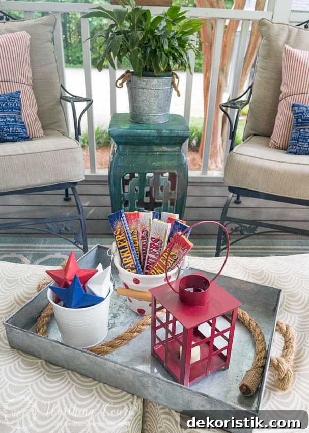 A farmhouse porch filled with loads of red, white and blue vintage Americana patriotic decorating ideas for Memorial Day, Flag Day and July 4th.