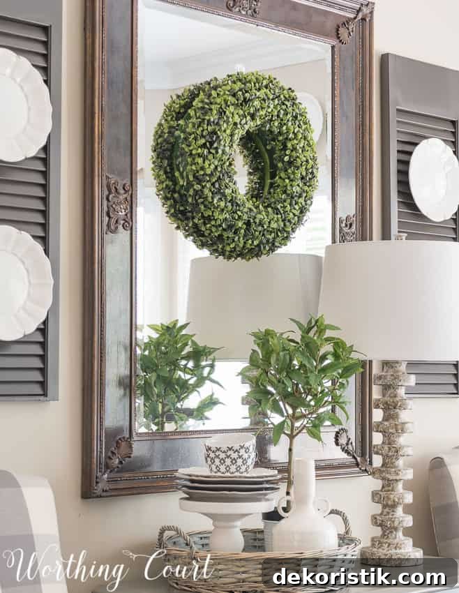 Farmhouse Dining Room Makeover - plates hanging on painted shutters and a small vignette