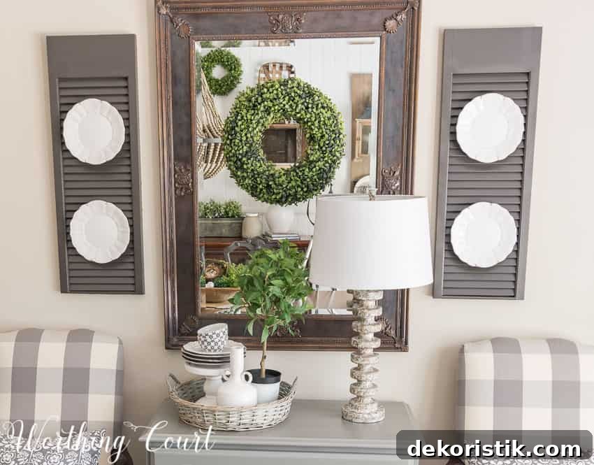 Farmhouse Dining Room Makeover - a mirror in a dark room adds a bit of light and relfect the pretty vignette across from it