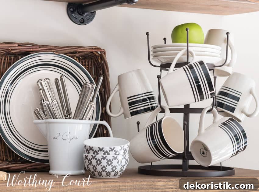 Mug tree holding black and white mugs from the dollar store