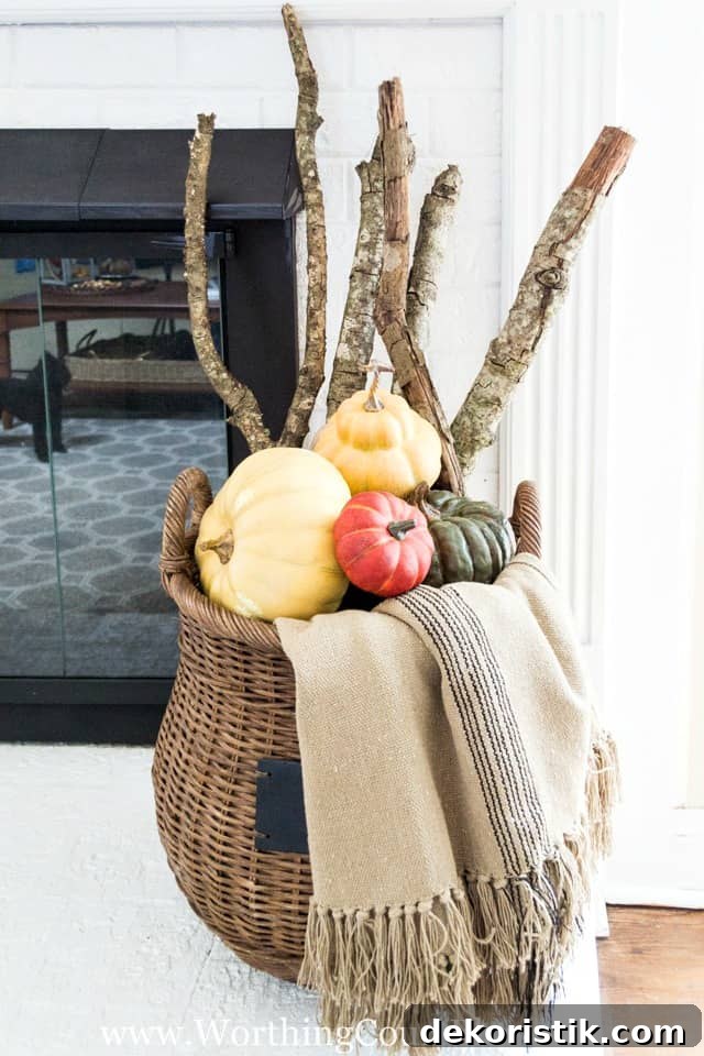 Fill a basket with sticks from your yard, a throw and multiple pumpkins for an easy fall display.