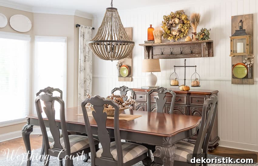 A beaded chandelier is over top the dining room table.