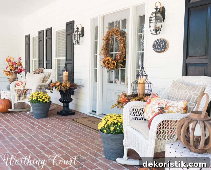 Fall front porch with wicker rockers and fall urns || Worthing Court