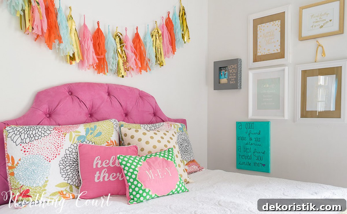gallery wall beside bed with layered art and handmade pieces