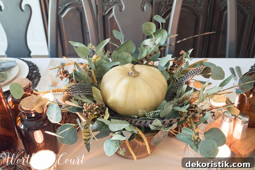 Thanksgiving centerpiece using a faux pumpkin, eucalyptus leaves and feathers || Worthing Court