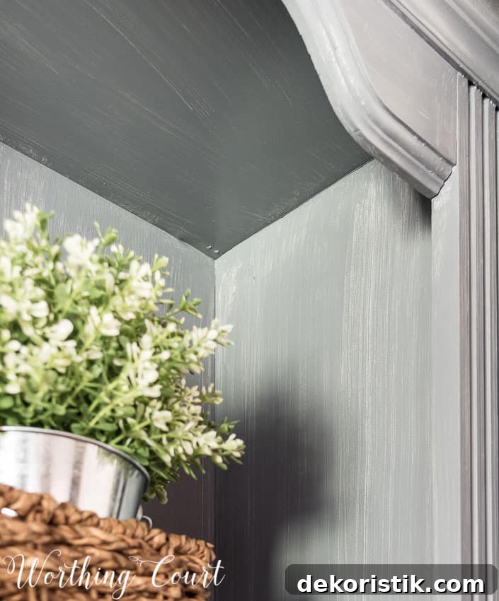Weathered wood look finish using gray stain on top of gray painted wood.