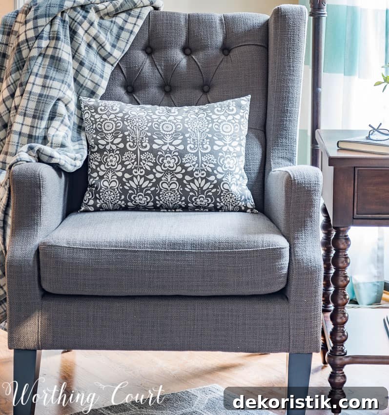 How to Create a Cohesive Family Room 5 Gray wing chair with tufted back || Worthing Court