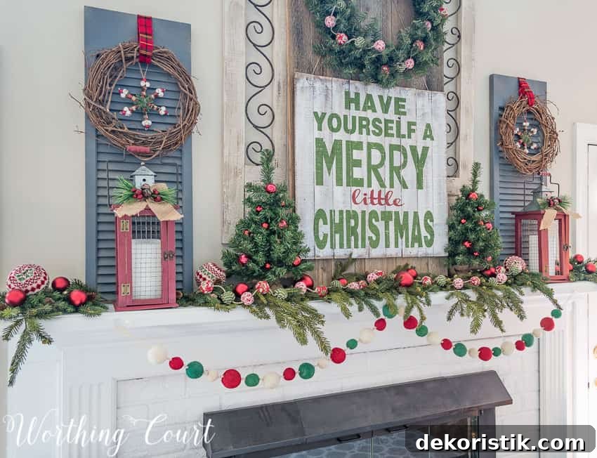 Grapevine wreaths, mini Christmas trees and decorative window shutters are on the mantel.