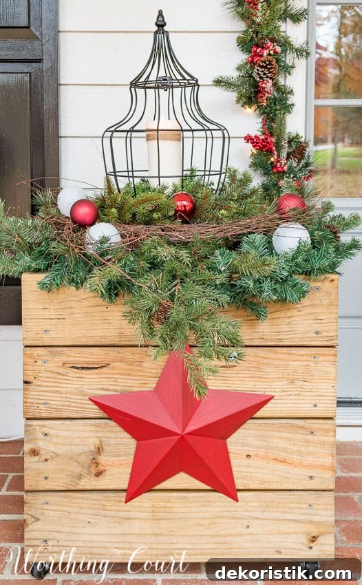 DIY rustic wood planter decorated for Christmas with red stars.