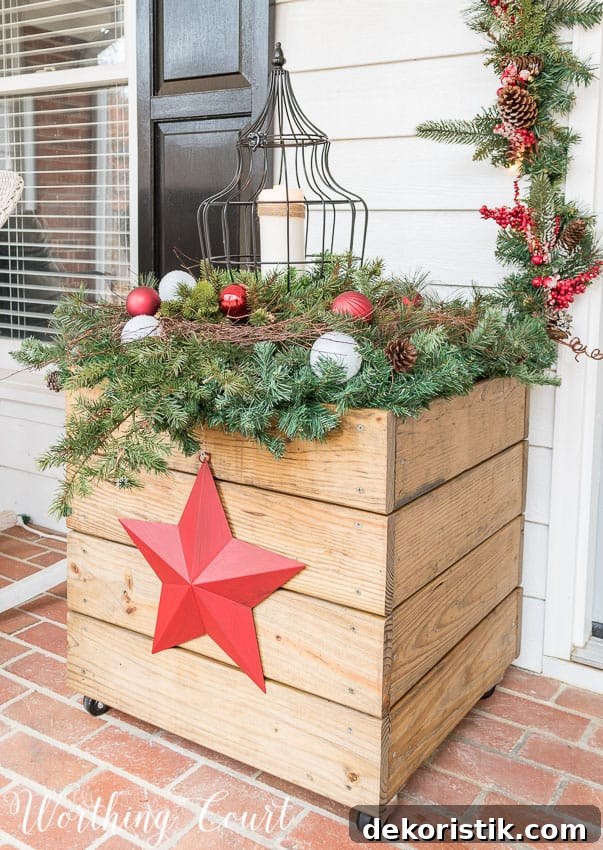 DIY wood planter decorated for Christmas with a red star.