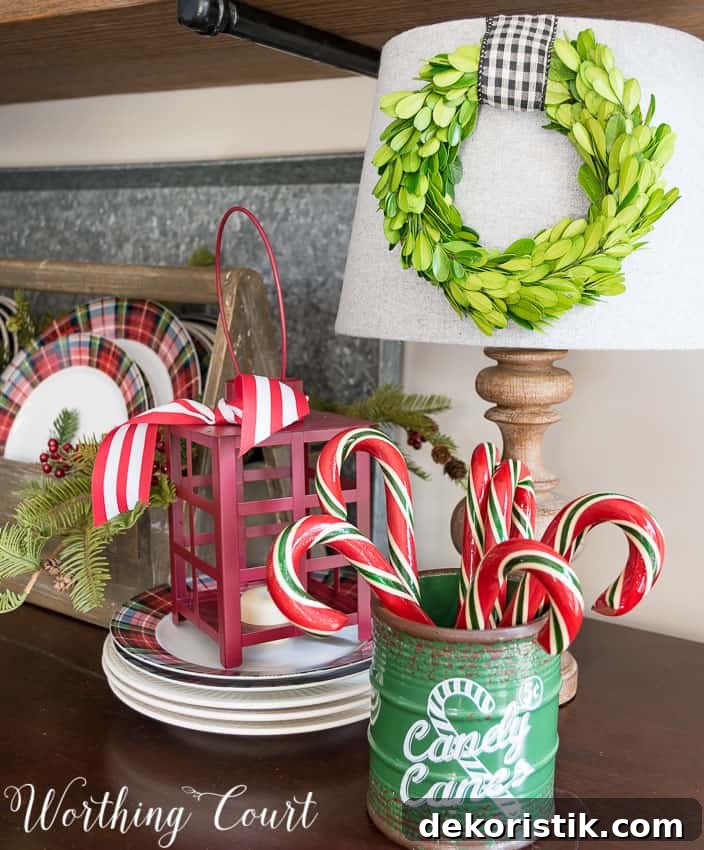 Farmhouse Christmas Breakfast Nook Decor Ideas 8 Christmas lantern and candy canes in the breakfast nook.