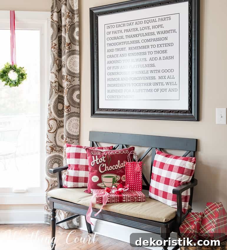 Farmhouse Christmas Breakfast Nook Decor Ideas 9 Bench with Christmas pillows on it.