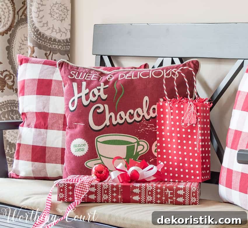 Farmhouse Christmas Breakfast Nook Decor Ideas 10 Red and white buffalo check Christmas pillows.