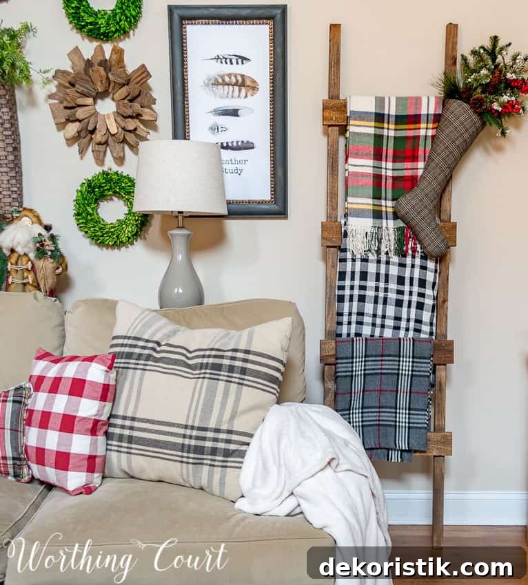 DIY rustic farmhouse ladder with Christmas throws and blankets.