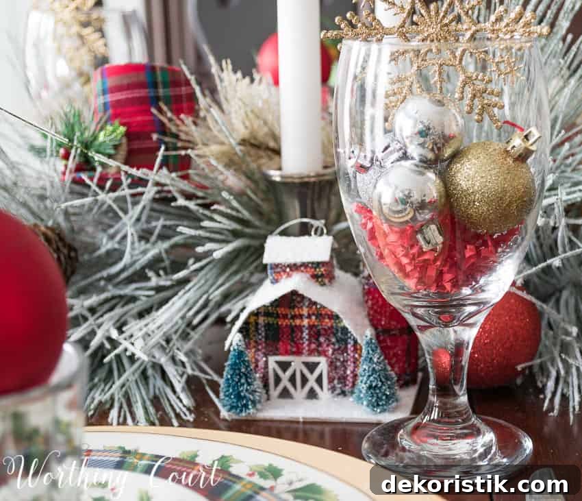 Christmas ornament house used as a centerpiece idea.