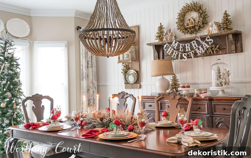 There is a beaded chandelier above the dining room table.