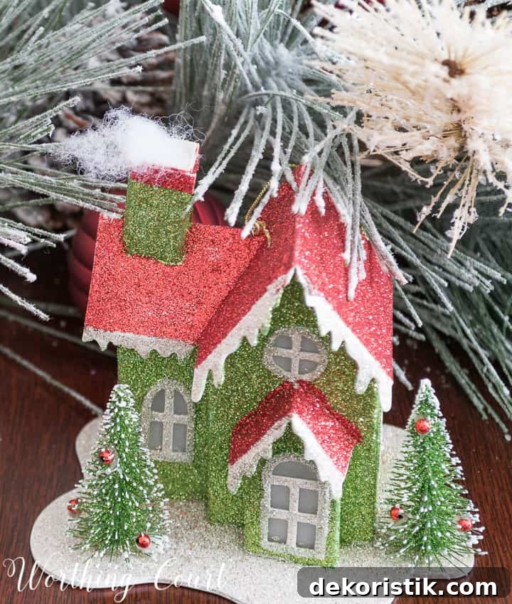 Christmas ornament cardboard glitter house in green and red.