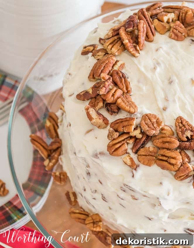 A ring of pecans adorn the top of the cake.