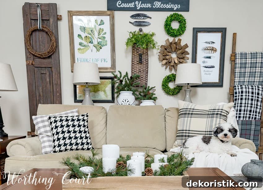 A neutral couch with blankets and throw pillows.